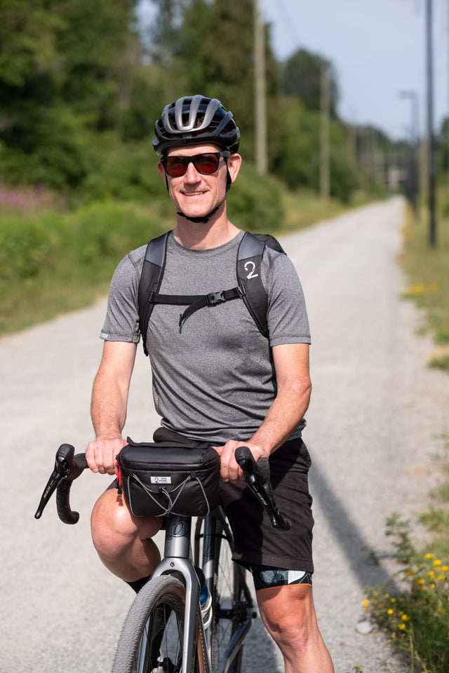 Two Wheel Gear - Handlebar Bag - Black - on front of bicycle with man