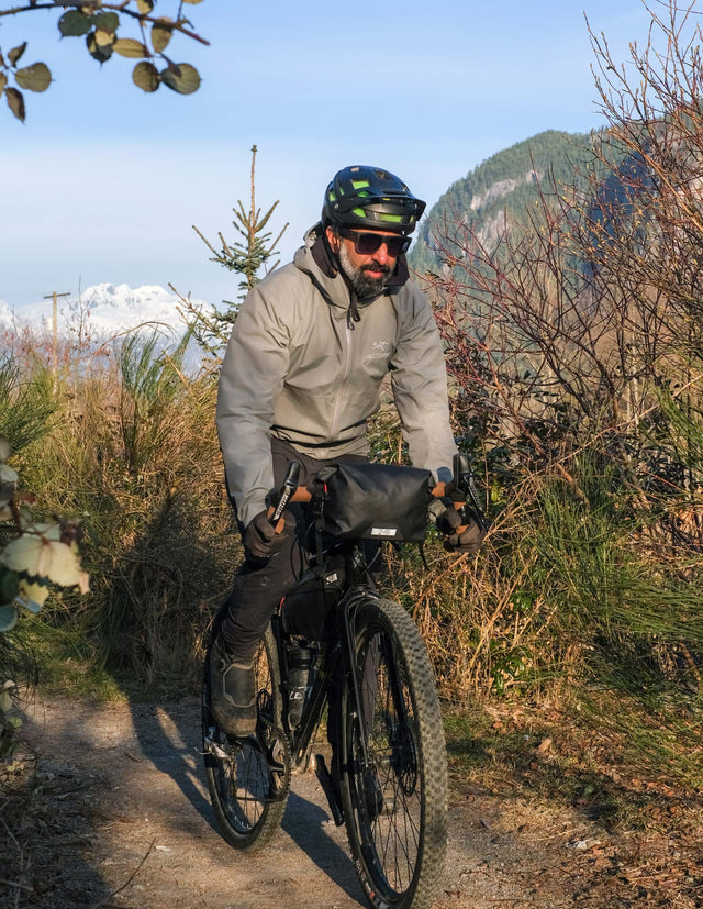 Man riding his bike in the trails with a Two Wheel Gear Dayliner Mini Handlebar Bag.