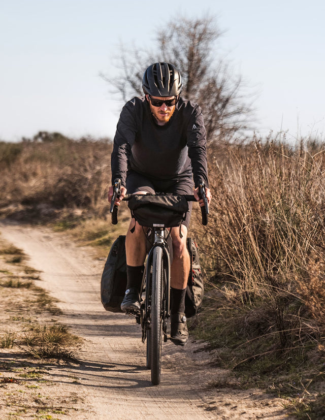 Man riding bike with Two Wheel Gear Dayliner Mini in the great outdoors.