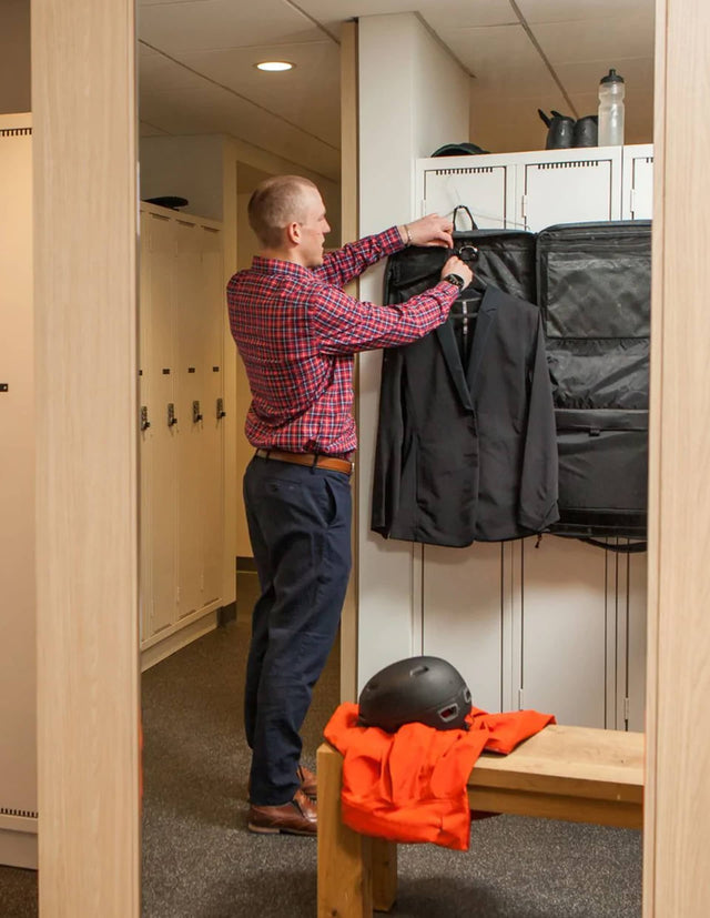 Man getting his suit out of his Two Wheel Gear Garment Pannier - Classic 3.0