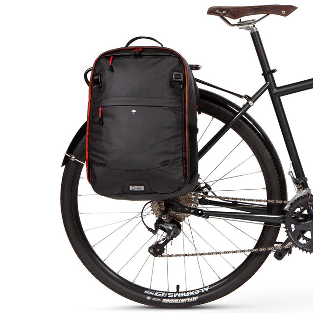 Weatherproof Two Wheel Gear Pannier Backpack Convertible 2.0 LITE (22L) in Black Ripstop attached to bike for commuting