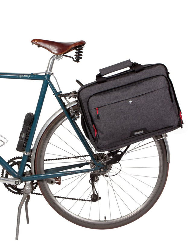 Pannier Laptop Messenger attached as a pannier on a bike rack.