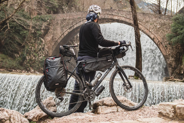 Man with Two Wheel Gear Bike Bags on a bike adventure