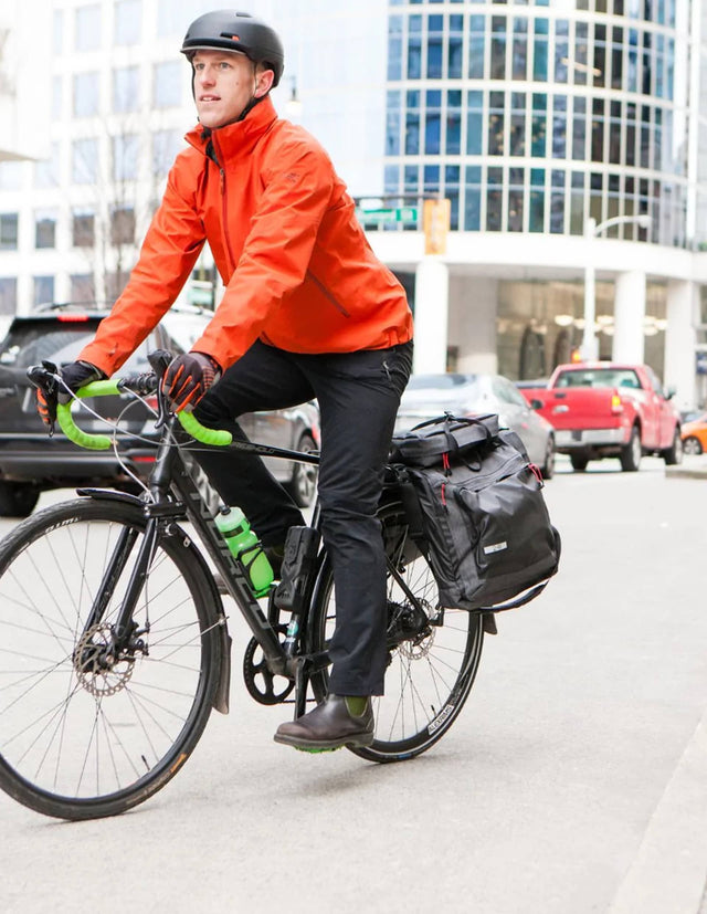Man commuting to work in the city on his bike using a Two Wheel Gear Garment Pannier - Classic 3.0
